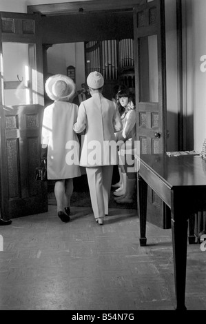 Arsenal centre half and Capt. of Northern Ireland world cup team Terry Neill had his hand full yesterday (Tues). His parcel was Stock Photo