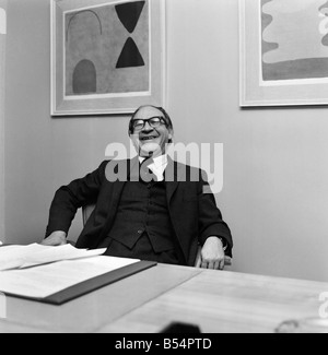 Politics. Fred Mulley Minister of Transport outlined his plans for a Christmas safety drive to Sunday Mirror motoring correspondent Roy Spicer this afternoon. Amongst the literature was a large poster and a driving manual which Mr. Mulley suggested (the manual) would be an ideal Christmas present for every driver. December 1969 Z11580-002 Stock Photo