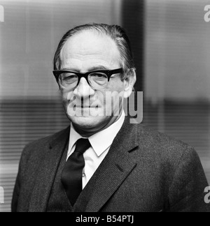 Politics. Fred Mulley Minister of Transport outlined his plans for a Christmas safety drive to Sunday Mirror motoring correspondent Roy Spicer this afternoon. Amongst the literature was a large poster and a driving manual which Mr. Mulley suggested (the manual) would be an ideal Christmas present for every driver. December 1969 Z11580-005 Stock Photo