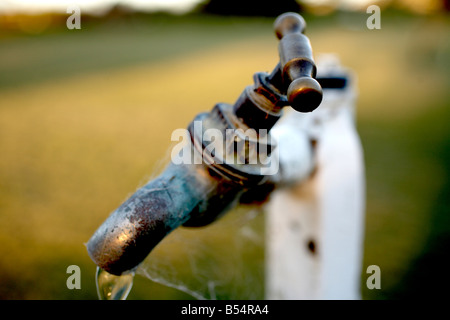 water stand pipe not in use with cobwebs covering it Stock Photo