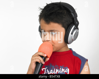 Asian boy of indian origin singing Stock Photo