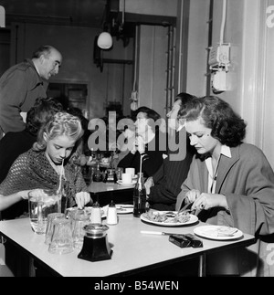 An unusual role for Margaret Lockwood is taking a back-stage seat. She chaperones her daughter Julia who gives a wonderful performance as Heidi in the television program. She is word-perfect and the talented daughter of Margaret is following in mother's footsteps. Margaret watches over her as she attends the studio. During rehearsals she never interferes will her daughter's TV program. The way Julia acts with complete disregard for the cameras coolly and confidently completely surprised her mother. She said 'I never knew she could do it'. November 1953 D6677-003 Stock Photo