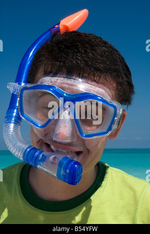 a tourist smiling into camera in a snorkeling equipment Stock Photo