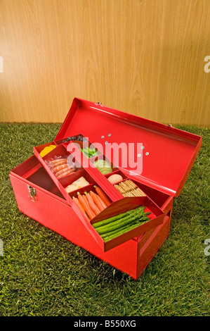 red tool box with food in top tray Stock Photo