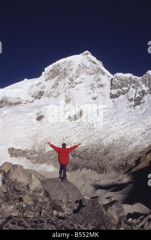 Trekker and Mount Huandoy East peak, Cordillera Blanca, Peru Stock Photo