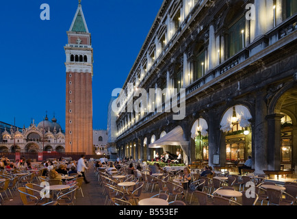 Restaurants in the Piazza San Marco at night in front of the Campanile and Basilica, Venice, Veneto, Italy Stock Photo