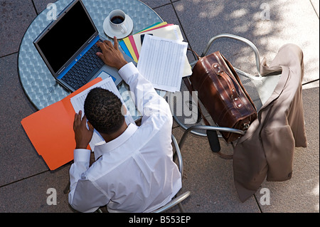 Young Businessman works on a computer outdoors Stock Photo