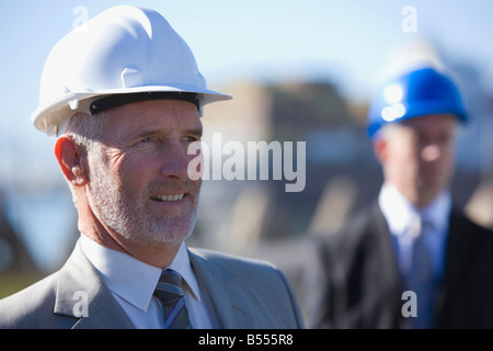 Two construction engineers together on survey Stock Photo