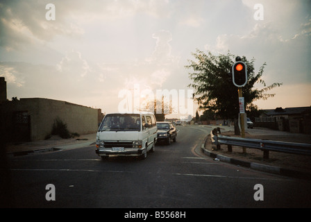 South Africa, Gauteng, Johannesburg, Soweto, Minibus taxi on the road at sunset Stock Photo