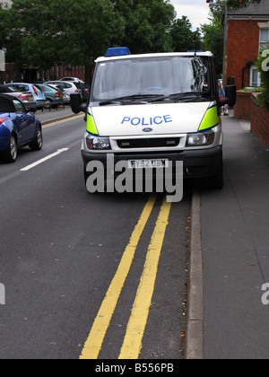 Police transit van, law, crime, cop, officer, emergency, security, uniform, protection, van, arrest, policeman, sign, authority, livery, blue lights. Stock Photo