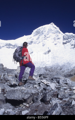 Trekker looking at view to Mt Huandoy East peak, Cordillera Blanca, Peru Stock Photo