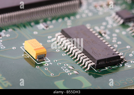 close up of a electronic hardware silicon chips on a green board Stock Photo
