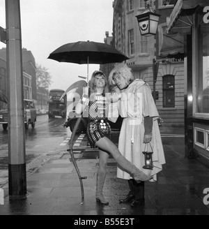 Actress Carol Dilworth will have no excuse for being late in 1968 she is wearing a dress made entirely from 50 giant pop watches January 1968 Y3 With Christopher Timothy dressed as Old Father Time Stock Photo