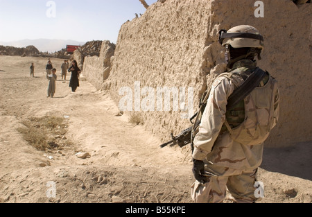 A U.S. soldier stands guard during a patrol in the town of Gardez, Paktia province, Afghanistan, October 2004. Stock Photo