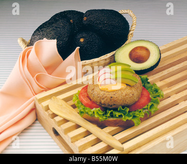 Heart-healthy turkey burger with avocado, tomato, lettuce and whole wheat bread. Stock Photo