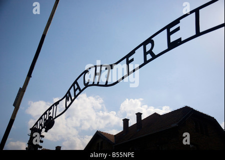 The infamous writing 'Arbeit macht frei' (='Work Brings Freedom') over the entrance gate in former concentration camp Auschwitz Stock Photo