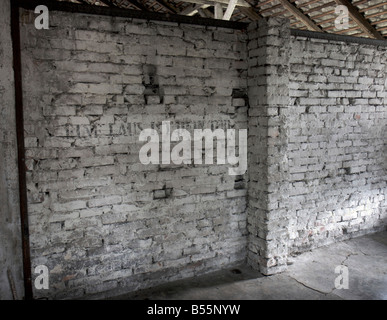 Inscription 'Eine Laus ist dein Tod' on a wall in a prisoners sleeping barrack in former concentration camp Auschwitz (Birkenau)