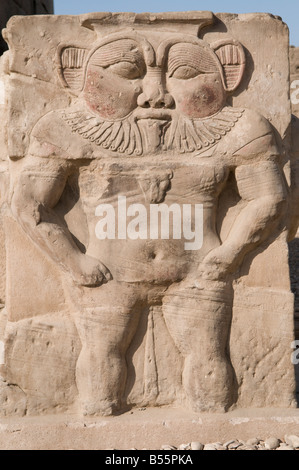 Relief of god Bes dating to the Ptolemaic-Roman period in the forecourt of the Hathor Temple at Dendera or Dendara in the province of Qena Egypt Stock Photo