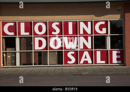 Closing down sale sign in shop window Stock Photo