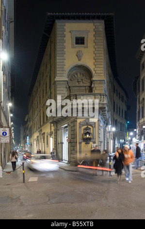 A junction in Florence 'old town' showing the small street architecture and people - slow shutter speed for motion blur. Stock Photo