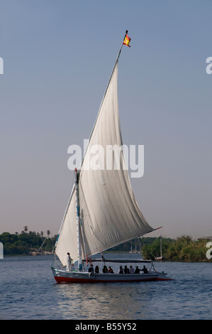 Traditional felucca boat sailing on the Nile river in Aswan Egypt Stock Photo