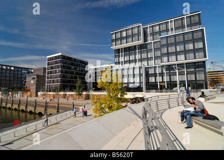 Modern residential- and office buildings along the Kaiserkai and Marco-Polo-Terrassen at the new Hafencity at the port of Hambur Stock Photo