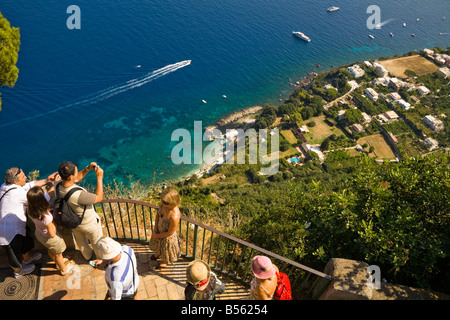 Tourists photographing view of Capri coastline from balcony at Villa San Michele, Anacapri, Capri, Italy Stock Photo