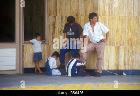 young shoeshine boys in Iquitos, Peru, South America Stock Photo