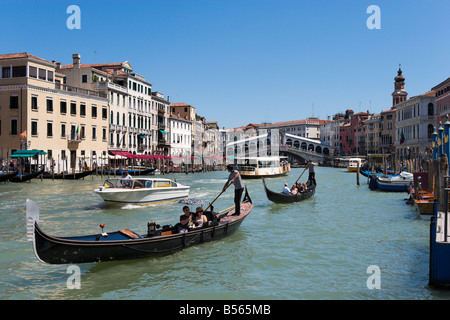 Gondolas on the Grand Canal with the Rialto Bridge in the background, San Marco, Venice, Veneto, Italy Stock Photo