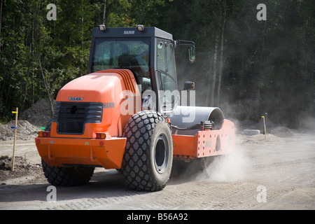 Hamm road roller compactor at road building site compacting the roadbed , Finland Stock Photo