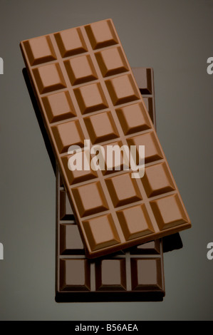 Chocolate bars on top of dark chocolate syrup Stock Photo