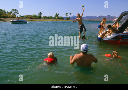 Families play in the waters of Lake Havasu, Parker Dam on the Colorado River,at Lake Havasu City, Arizona, USA Stock Photo