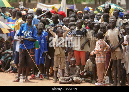 A crowd of men women and children gather in Freedom Square to attend the Africa Malaria Day festivities in Rumbek South Sudan Stock Photo