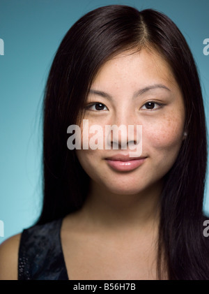 Close-up portrait of young and confident Chinese woman in a studio setting Stock Photo