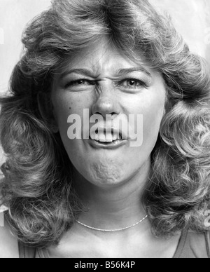 Beauty without surgery - facial exercises. Model Sara Jailkden. July 1980 P009175 Stock Photo