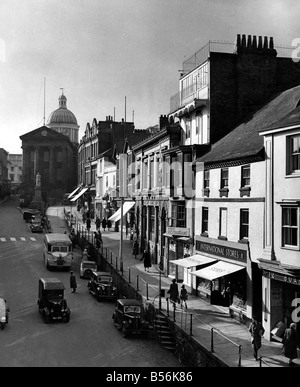 Penzance the most Westerly town in Gt. Britain. This is Market Jew street the towns most important shopping centre, and the domed Market House. The statue is of Sir Humphry Davy a Cornishman who invented the Miners Safety Lamp. February 1953 P009221 Stock Photo
