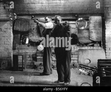 Jars of pulled cane and frit glass blowing supplies Stock Photo - Alamy