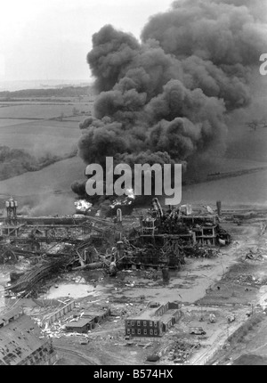 Disaster Blast At Flixborough A massive blast ripped apart an entire village late on Saturday afternoon, 1st June 1974. At least 29 people died and 100 houses were wrecked when an explosion shook the Nypro chemical plant at the Lincolnshire village of Flixborough. 3,000 people were evacuated as firemen tried to prevent an escape of poisonous gas from ammonia tanks, seven miles away in Scunthorpe flying glass caused injuries and homes shook thirty miles away. The scene of devastation at Nypro works, Flixborough. June 1974 P004443 Stock Photo