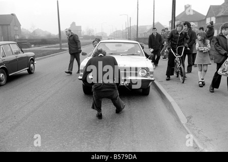 Strongman Reg Morris pulls car and passengers with his teeth. February 1975 75-00777-001 Stock Photo