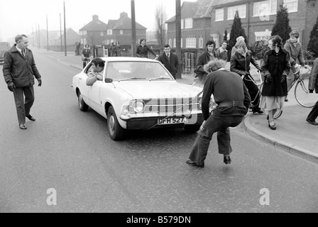 Strongman Reg Morris pulls car and passengers with his teeth. February 1975  75-00777-007 Stock Photo