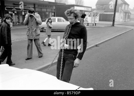 Strongman Reg Morris pulls car and passengers with his teeth. February 1975  75-00777-008 Stock Photo