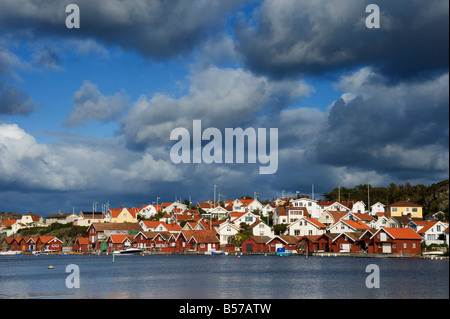 Brightly painted wooden houses in fishing village of Fiskebackskil on Swedens Bohuslan Coast Stock Photo