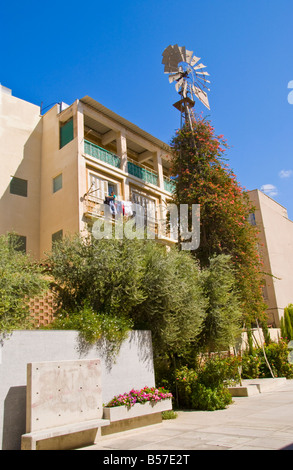 Apartment block with windmill outside in city centre in Southern Nicosia Cyprus EU Stock Photo