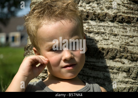 Little six year old boy thinking Stock Photo