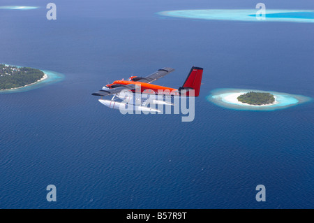 Aerial view of Maldivian air taxi flying above islands in the Maldives, Indian Ocean, Asia Stock Photo