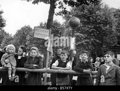 Children of Elgin Terrace in Maida Vale, London, look up at the bomb damage near their homes after a V1 flying bomb attack. ;June 1944 ;P009494 Stock Photo