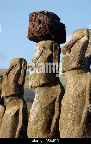 Three of the fifteen huge moai statues standing with their backs to the ocean, Ahu Tongariki, Easter Island, Chile Stock Photo