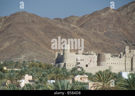 Fort in palmery on edge of modern oasis town, Bahla, Oman, Middle East Stock Photo