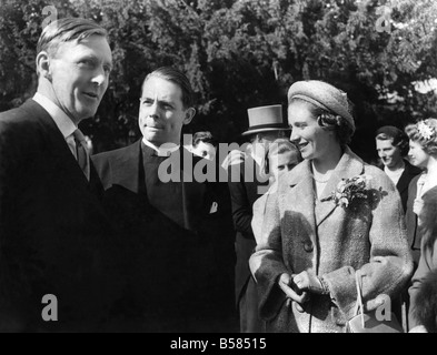 Peter May Weds. The Wedding of Peter May, England and Surrey cricket captain, and Miss Virginia Gilligan, 24, Eldest Daughter of former Susses captain Harold Gilligan and Mrs. Gilligan, of Franklins, Shamley Green, Near Guildford, Took Place at Cranleigh Parish Church, today. The Bride Wore a Full-Length White Parchment Satin Dress which she helped to Design, and her Long Veil Was Held In Place by a Feathered head-dress She carried a Shower Bouquet of Lily-of-the-Valley, stephanotis, White Roses and White Orchids. April 1959 P005531 Stock Photo