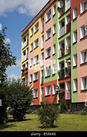 Brightly painted block of flats on housing estate Poland Stock Photo